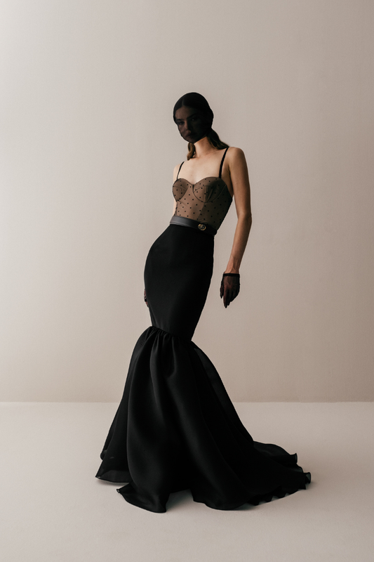 Her Long Gathered Black Skirt