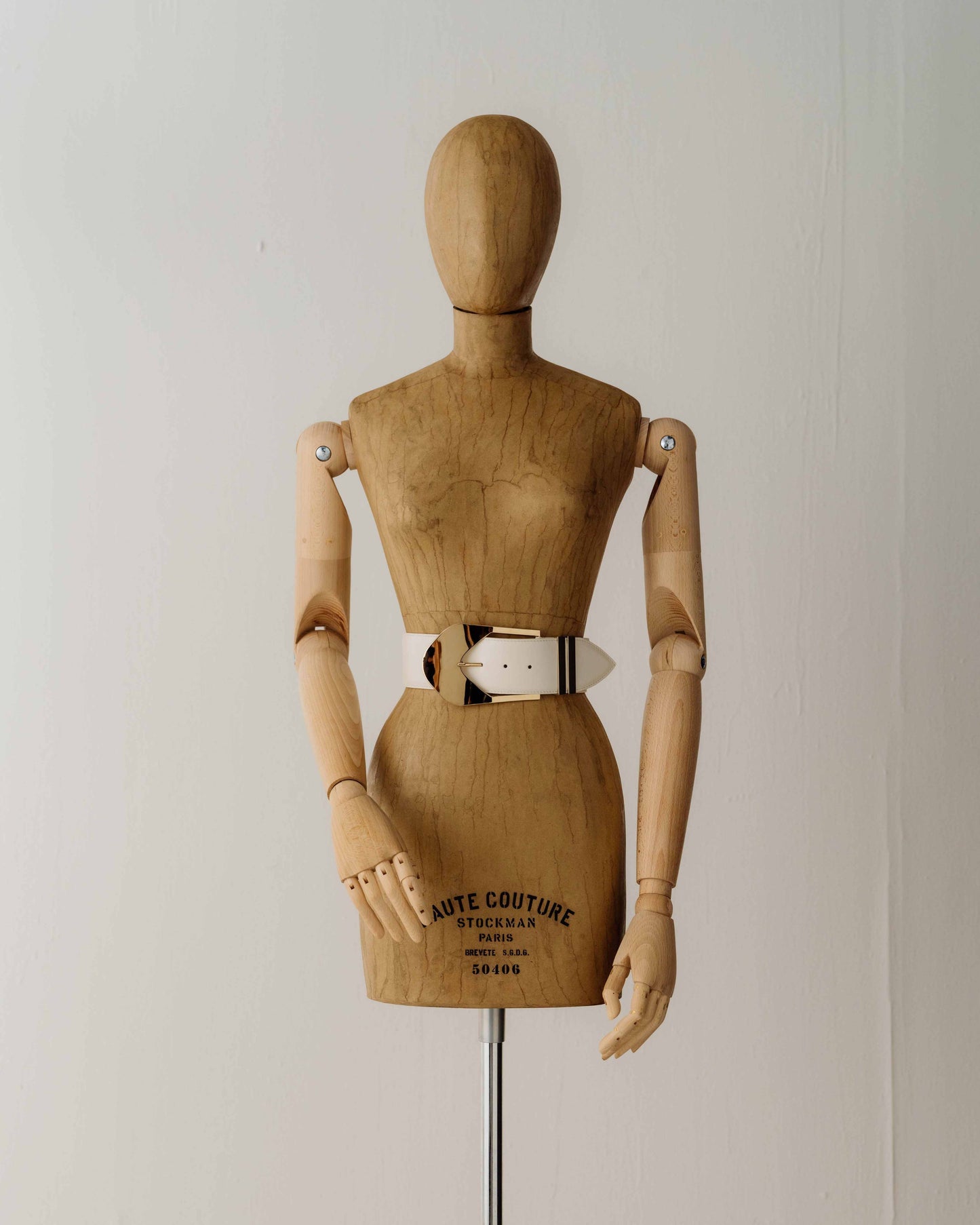 Her Sculpted White Buckle Belt