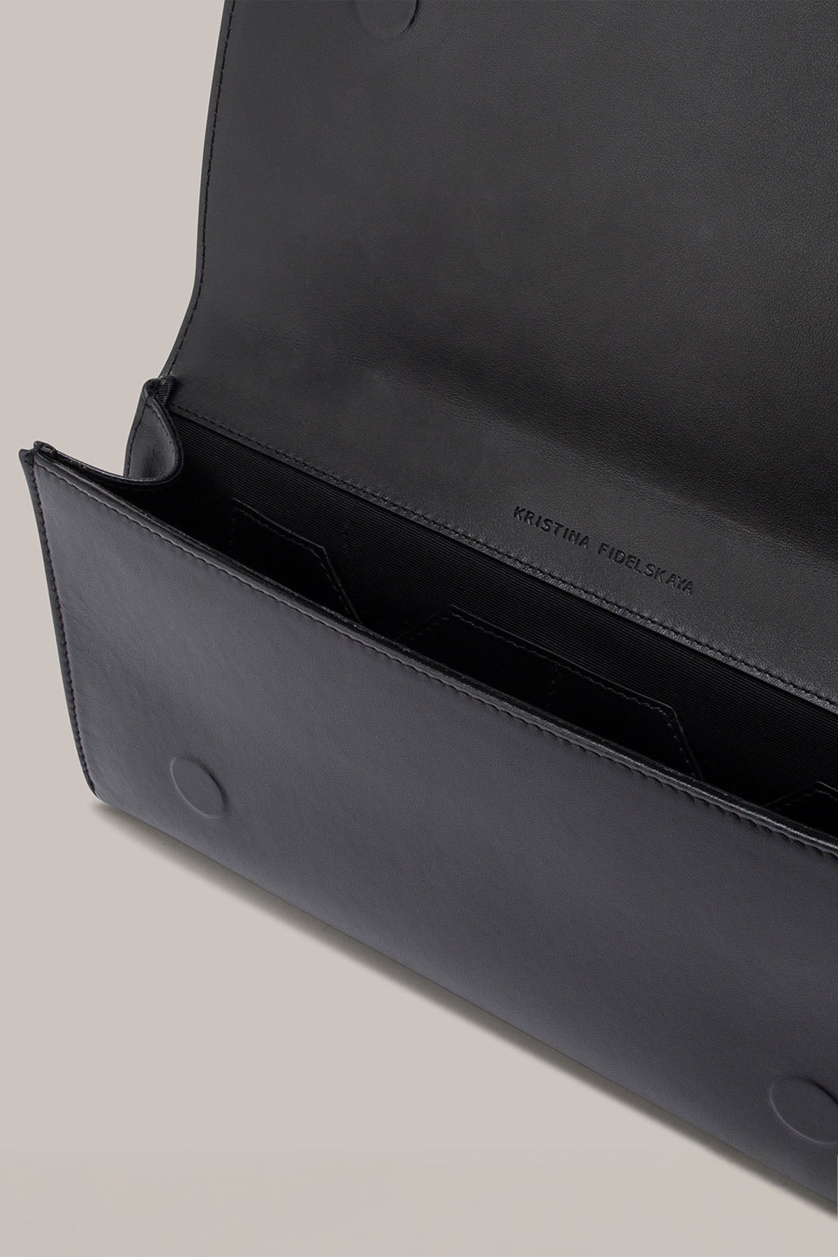Her Black Leather Bag